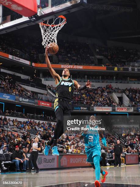 Tyrese Haliburton of the Indiana Pacers drives to the basket during the game against the Charlotte Hornets on December 20, 2023 at Gainbridge...