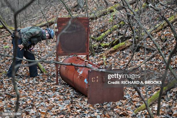 This photo taken early on November 10, 2023 shows Junpei Tanaka, a wildlife expert for the nonprofit organisation Picchio Wildlife Research Center,...