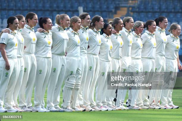 Players of Australia stand for the National anthem during day one of the Women's Test Match between India and Australia at Wankhede Stadium on...