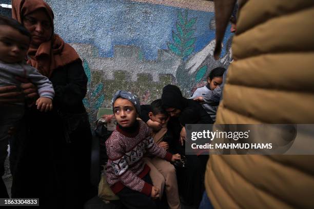 Relatives of Jehad Arafat, who was killed in Israeli bombardment, mourn ahead of his funeral at the Najjar hospital in Rafah, in the southern Gaza...