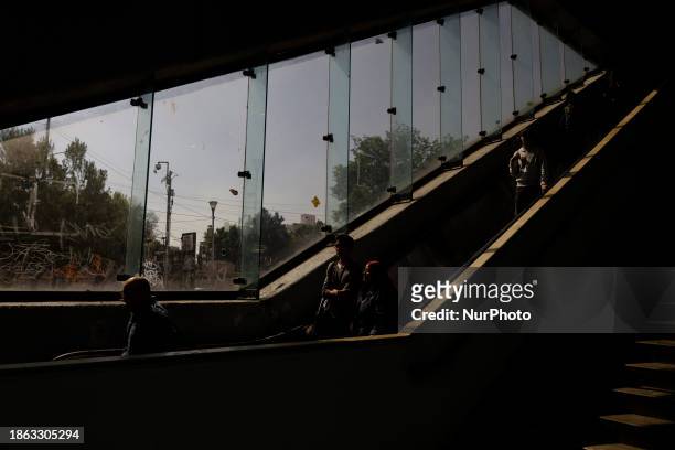 Users of the Metro Collective Transportation System are seen in Mexico City.