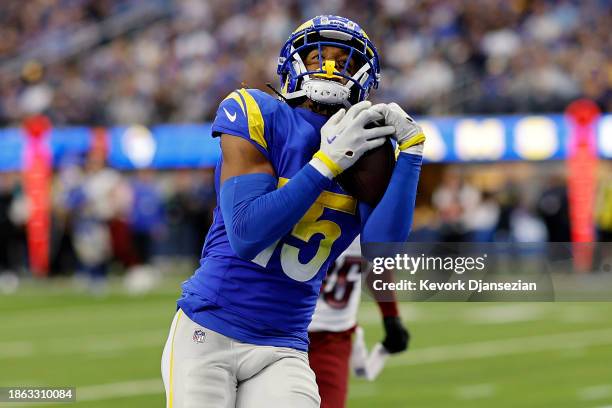Demarcus Robinson of the Los Angeles Rams catches a touchdown pass during the second half of the game against the Washington Commanders at SoFi...