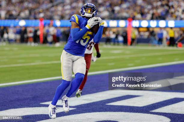 Demarcus Robinson of the Los Angeles Rams catches a touchdown pass during the second half of the game against the Washington Commanders at SoFi...