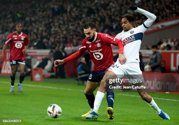 Nabil Bentaleb of Lille, Bradley Barcola of PSG in action during the Ligue 1 Uber Eats match between Lille OSC and Paris Saint-Germain at Stade...