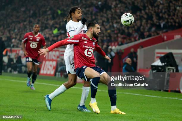 Nabil Bentaleb of Lille, Bradley Barcola of PSG in action during the Ligue 1 Uber Eats match between Lille OSC and Paris Saint-Germain at Stade...