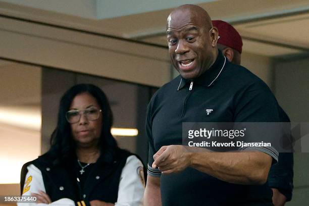 Minority Owner Magic Johnson of the Washington Commanders with wife Cookie Johnson react during the game against the Los Angeles Rams at SoFi Stadium...