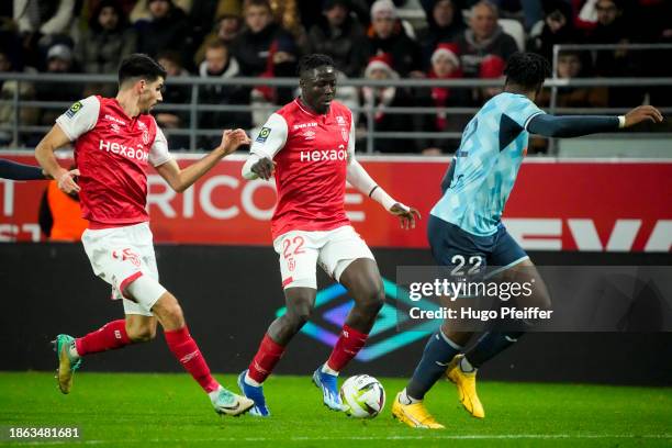 Thibualt DE SMET of Reims, Oumar DIAKITE of Reims and Yoann SALMIER of Le Havre during the Ligue 1 Uber Eats match between Stade de Reims and Havre...