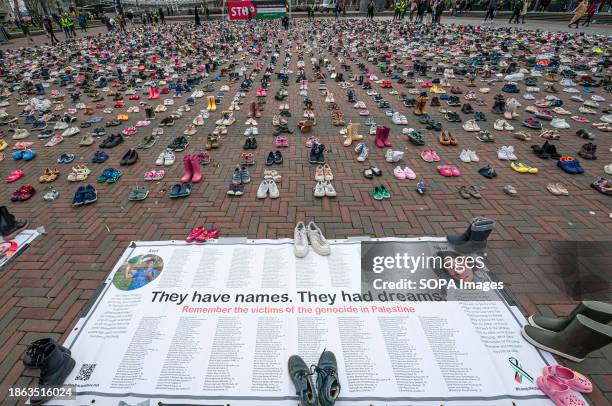 They have names. They had dreams.' Large poster naming some of those killed by Israel, during its 10-week siege on Gaza. More than 8000 pairs of...