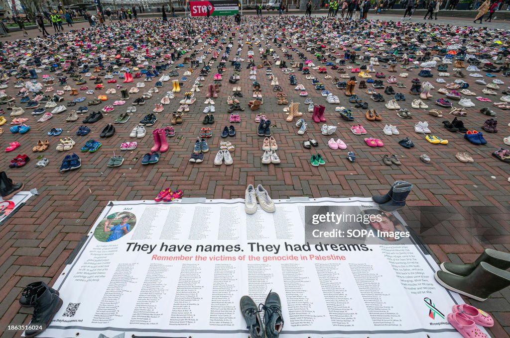 'They have names. They had dreams.' Large poster naming...