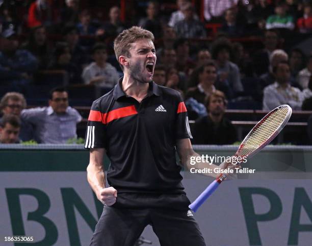 Gilles Simon of France reacts after winning his second round match against Nicolas Mahut of France during the BNP Paribas Masters at Palais...