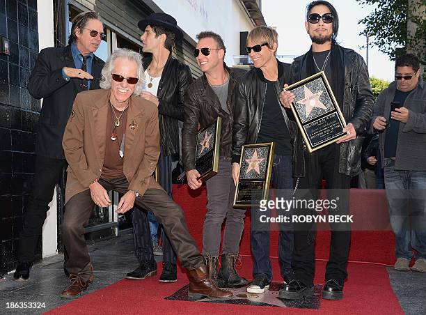 John Densmore of The Doors and John Doe from X pose with, from left, Perry Farrell, Stephen Perkins, Chris Chaney and Dave Navarro of the alt-rock...