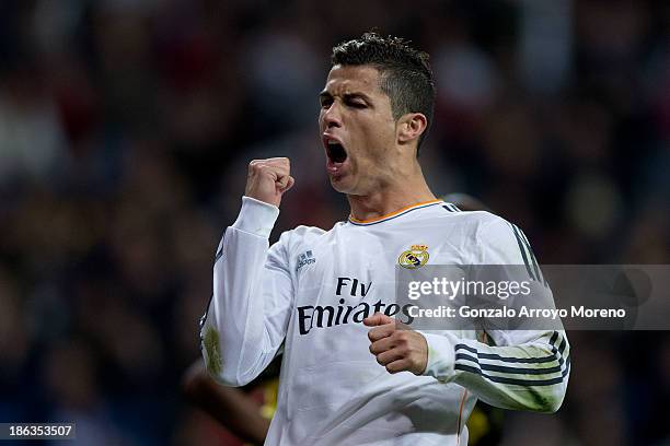 Cristiano Ronaldo of Real Madrid CF celebrates scoring their third goal during the La Liga match between Real Madrid CF and Sevilla FC at Estadio...