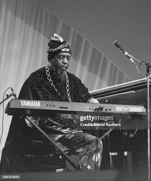 American jazz pianist, bandleader and composer Sun Ra performing with his Arkestra at the Newport Jazz Festival, Newport, Rhode Island, circa 1980.