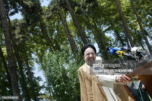 Iranian President Mohammad Khatami smiles during his press conference following a cabinet meeting in Tehran 14 July 2004. Khatami blamed Britain,...