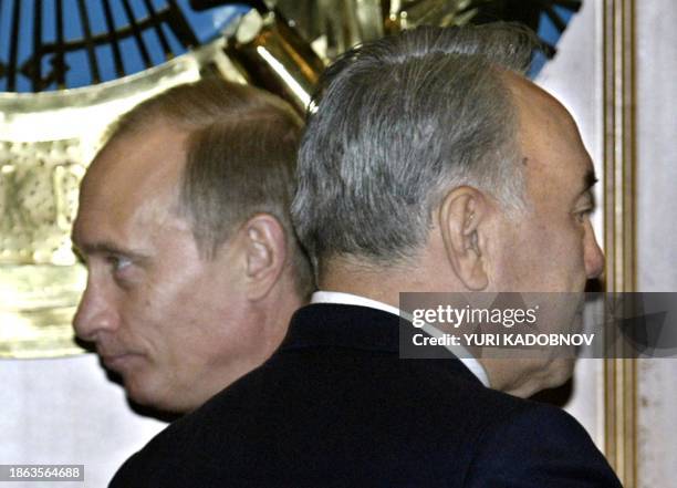Russian President Vladimir Putin passes by his Kazakh counterpart Nursultan Nazarbayev during a signing ceremony in Astana, 09 January 2004. The...