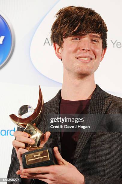 James Blake poses in front of the winners boards during the Barclaycard Mercury Prize 2013 at The Roundhouse on October 30, 2013 in London, England.