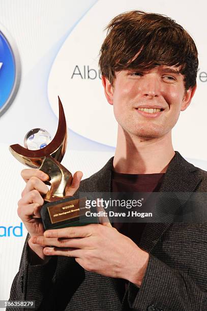James Blake poses in front of the winners boards during the Barclaycard Mercury Prize 2013 at The Roundhouse on October 30, 2013 in London, England.