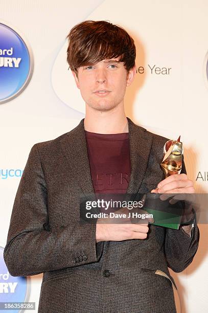 James Blake poses in front of the winners boards during the Barclaycard Mercury Prize 2013 at The Roundhouse on October 30, 2013 in London, England.