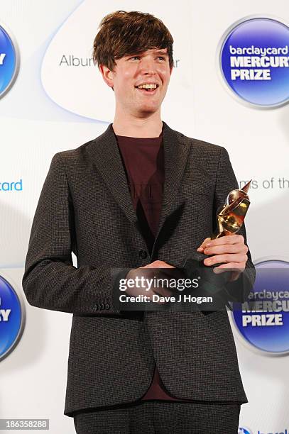 James Blake poses in front of the winners boards during the Barclaycard Mercury Prize 2013 at The Roundhouse on October 30, 2013 in London, England.