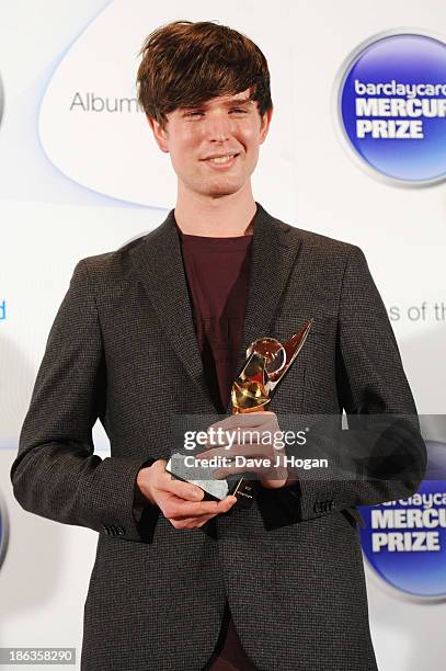 James Blake poses in front of the winners boards during the Barclaycard Mercury Prize 2013 at The Roundhouse on October 30, 2013 in London, England.