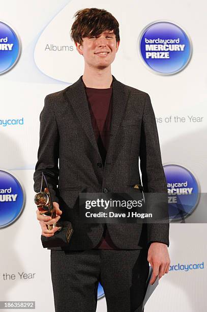 James Blake poses in front of the winners boards during the Barclaycard Mercury Prize 2013 at The Roundhouse on October 30, 2013 in London, England.