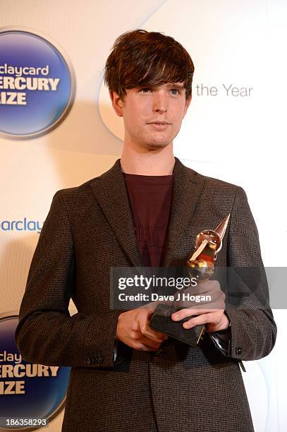 James Blake poses in front of the winners boards during the Barclaycard Mercury Prize 2013 at The Roundhouse on October 30, 2013 in London, England.