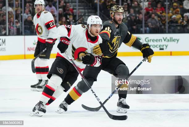 Angus Crookshank of the Ottawa Senators skates against Nicolas Roy of the Vegas Golden Knights during the second period at T-Mobile Arena on December...