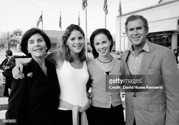 Texas Governor George Bush and wife Laura Bush flank daughters Jenna and Barbara at the Bush Library opening November 21, 1999 in College Station,...