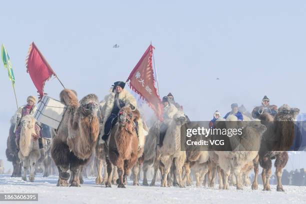 Mongolians take part in the 20th Winter Naadam Fair of Inner Mongolia at Prairie Chenbarhu banner on December 17, 2023 in Hulunbuir, Inner Mongolia...