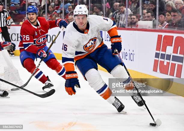 Julien Gauthier of the New York Islanders skates the puck during the third period against the Montreal Canadiens at the Bell Centre on December 16,...