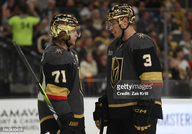 William Karlsson and Brayden McNabb of the Vegas Golden Knights talk during the second period against the Ottawa Senators at T-Mobile Arena on...