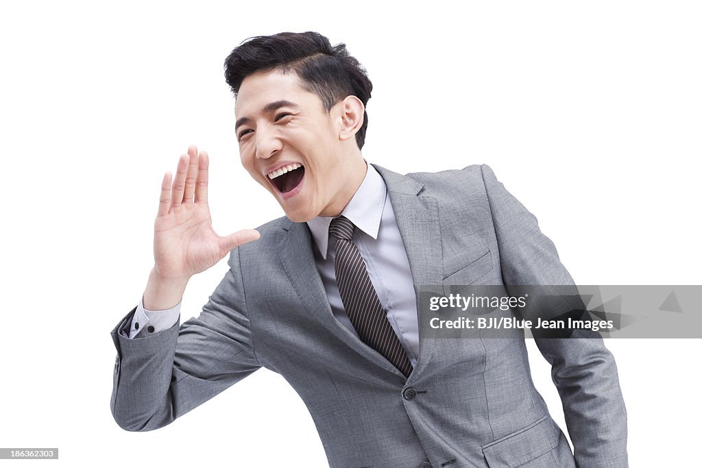 Confident young businessman shouting