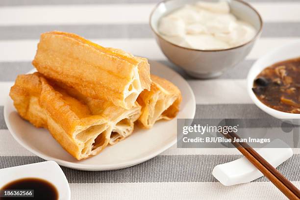 chinese food youtiao and tofu jelly - youtiao stock pictures, royalty-free photos & images