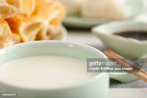 chinese food soybean milk and youtiao - youtiao stock pictures, royalty-free photos & images