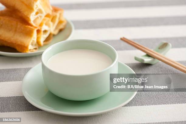 soybean milk and fried sticks - youtiao stock pictures, royalty-free photos & images