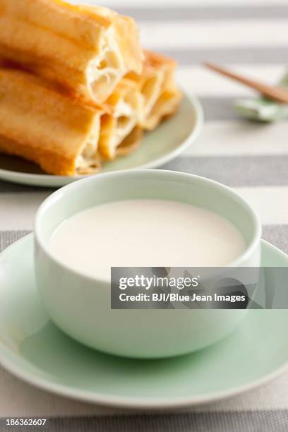 soybean milk and fried sticks - youtiao stock pictures, royalty-free photos & images