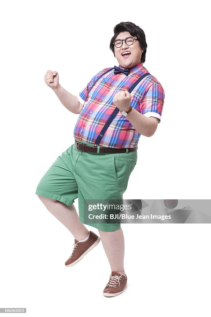 Fat Rave Man Fashionable Fat Man Celebrating With Excitement High-Res Stock Photo ...