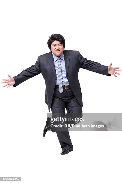 happy overweight businessman dancing - fat man in suit stock pictures, royalty-free photos & images