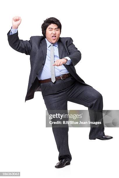 happy overweight businessman dancing - fat man in suit stock pictures, royalty-free photos & images