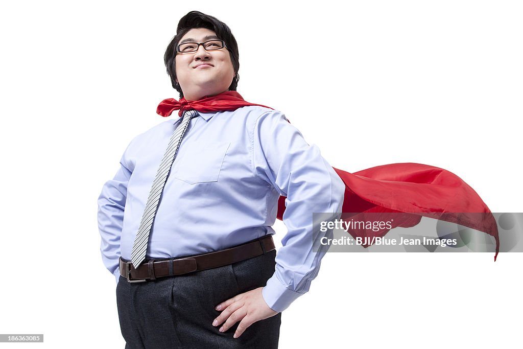 Overweight businessman playing the part of superman