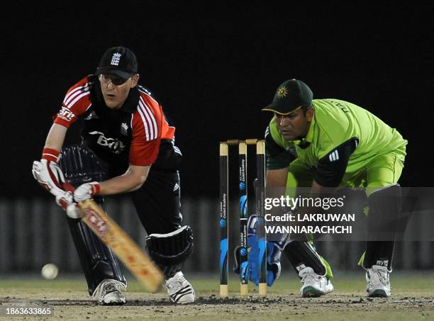 England's disabled cricket captain James Williams plays a shot as Pakistan's wicketkeeper Danish Ahmed looks on during the ODI match between England...