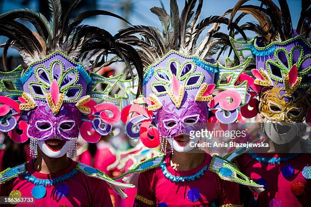 Masskara Festival performers wearing colorful masks. MassKara Festival, one of the biggest and most colorful Filipino festivals, is held every year...