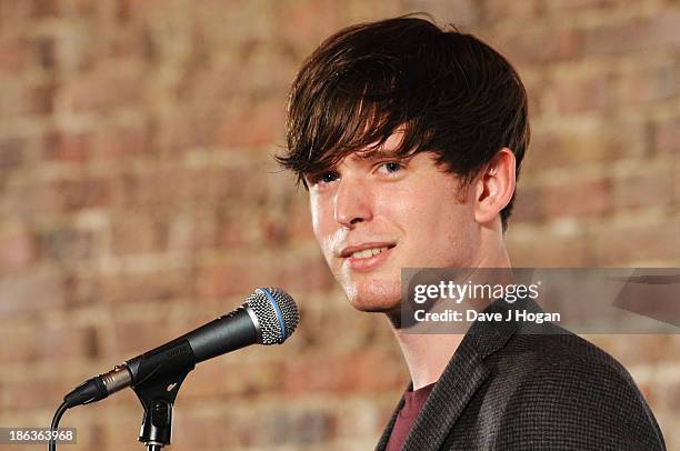 James Blake poses in front of the winners boards during the Barclaycard Mercury Prize 2013 at The Roundhouse on October 30, 2013 in London, England.