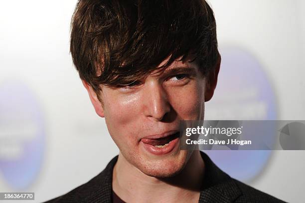 James Blake poses in front of the winners boards during the Barclaycard Mercury Prize 2013 at The Roundhouse on October 30, 2013 in London, England.