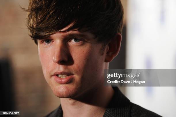 James Blake poses in front of the winners boards during the Barclaycard Mercury Prize 2013 at The Roundhouse on October 30, 2013 in London, England.