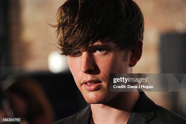 James Blake poses in front of the winners boards during the Barclaycard Mercury Prize 2013 at The Roundhouse on October 30, 2013 in London, England.