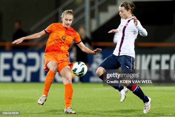 Vivianne Miedema of the Netherlands vies for the ball with Nora Berge of Norway during the Fifa World Cup 2015 qualifying football match Netherlands...