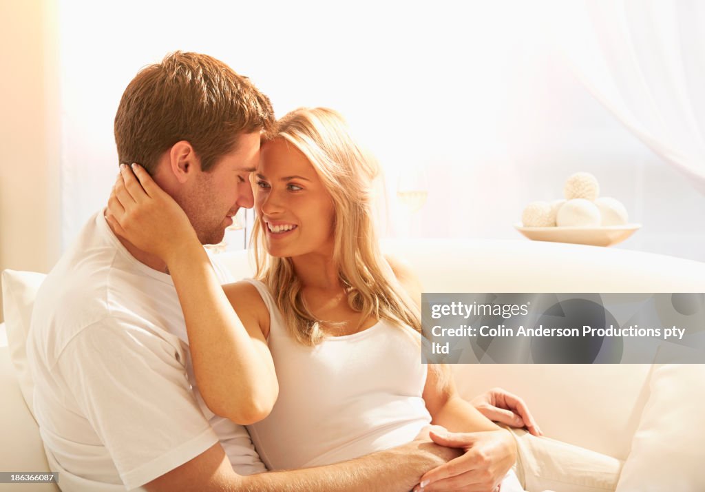 Caucasian couple relaxing on sofa