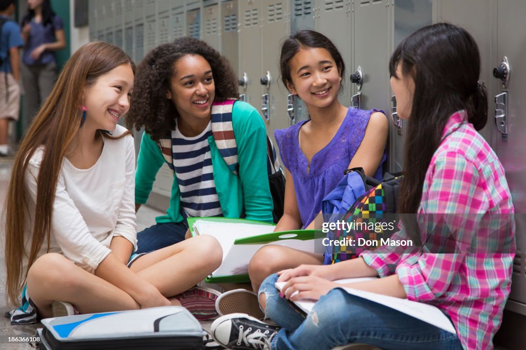 Students talking in school corridor