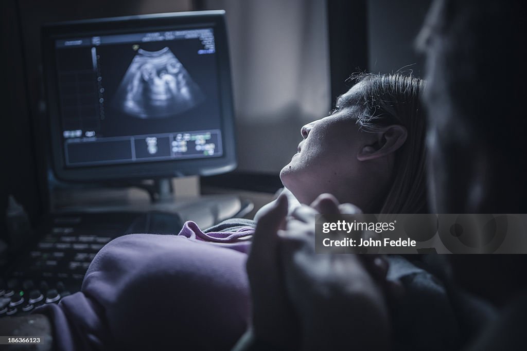 Pregnant couple having sonogram